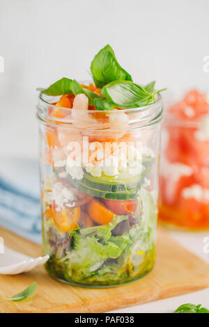 Tasty served salad wuth prawns in jar on table. Ready to eat. Detox Clean Eating Concept Stock Photo