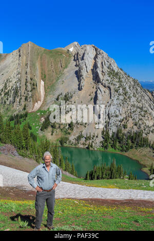 self portrait of john lambing above frazier lake in the bridger mountains near bozeman, montana Stock Photo