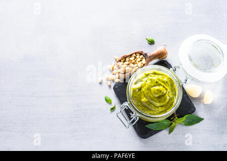 Pesto sauce in glass jar.  Stock Photo