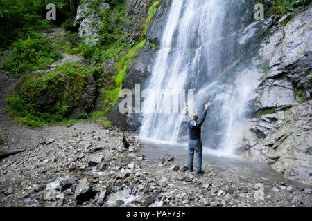 Man standing in a wa