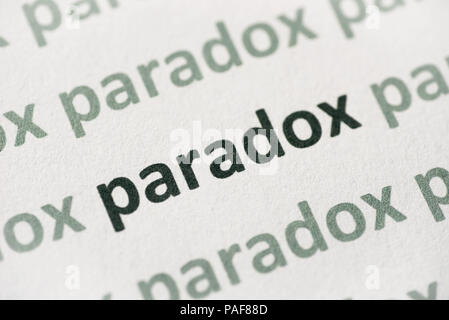word paradox printed on white paper macro Stock Photo