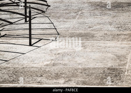 grey tiled floor with shadows from a canopy Stock Photo