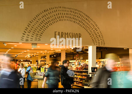 Interior view of entrance to the farm shop in the M5 motorway services in Gloucester. Slow shutter speed to blur the motion of visitors. Stock Photo