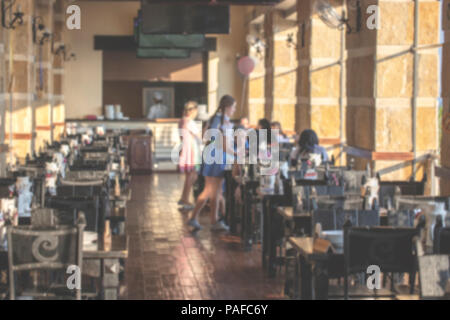 Blurred image of people sitting in cafe. Vintage effect. Stock Photo