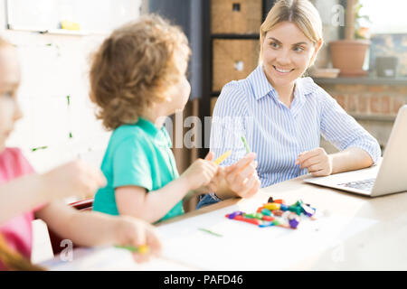 Mother playing with kids Stock Photo