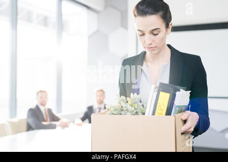 Sad Businesswoman Leaving Job Stock Photo