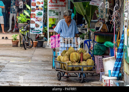 Man selling Durians at a fruit stall in Kuala Lumpur, Malaysia Stock ...