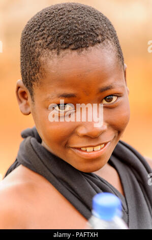 PORTO-NOVO, BENIN - MAR 10, 2012: Unidentified Beninese man walks with ...