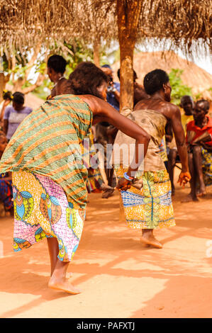 KARA, TOGO - MAR 11, 2012:  Unidentified Togolese woman in a traditional dressdances the religious voodoo dance. Voodoo is the West African religion Stock Photo