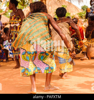 KARA, TOGO - MAR 11, 2012:  Unidentified Togolese woman in a traditional dressdances the religious voodoo dance. Voodoo is the West African religion Stock Photo