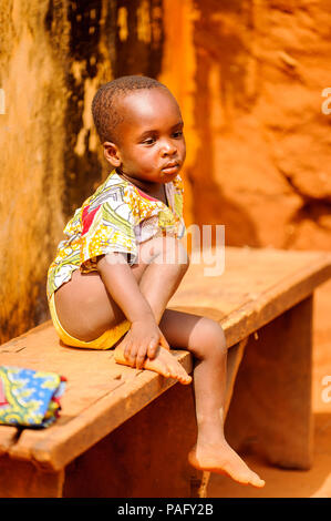 KARA, TOGO - MAR 11, 2012:  Unidentified Togolese boy watches the religious voodoo dance. Voodoo is the West African religion Stock Photo