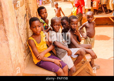 KARA, TOGO - MAR 11, 2012:  Unidentified Togolese children watch the religious voodoo dance. Voodoo is the West African religion Stock Photo