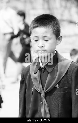 NORTH KOREA - MAY 1, 2012: Portrait of a Korean pioneer boy during the celebration of the International Worker's Day in N.Korea, May 1, 2012. May 1 is Stock Photo