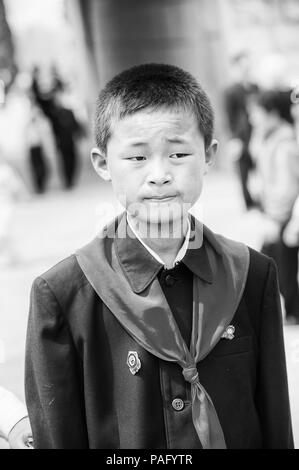 NORTH KOREA - MAY 1, 2012: Portrait of a Korean pioneer boy during the celebration of the International Worker's Day in N.Korea, May 1, 2012. May 1 is Stock Photo