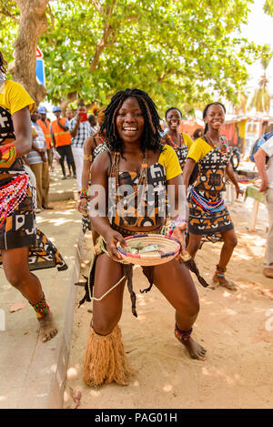 ANGOLA, LUANDA - MARCH 4, 2013: Smiling Angolan woman dances the local