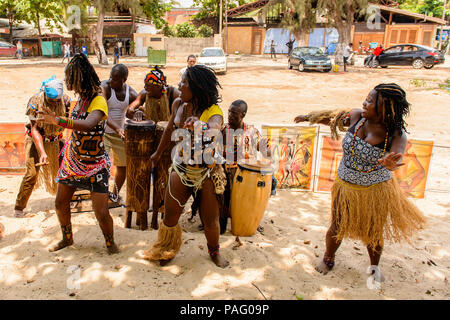 ANGOLA, LUANDA - MARCH 4, 2013:  Unidentified Angolan women make the street performance of the national falk dance for the tourists in Angola, Mar 4,  Stock Photo