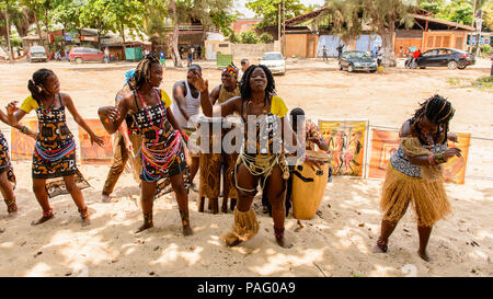 ANGOLA, LUANDA - MARCH 4, 2013:  Unidentified Angolan women make the street performance of the national falk dance for the tourists in Angola, Mar 4,  Stock Photo