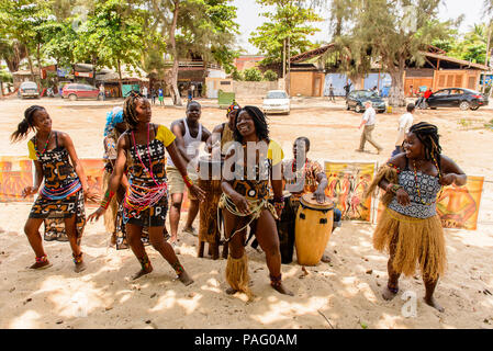 ANGOLA, LUANDA - MARCH 4, 2013:  Unidentified Angolan women make the street performance of the national falk dance for the tourists in Angola, Mar 4,  Stock Photo