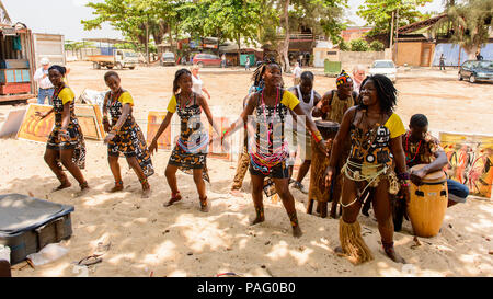 ANGOLA, LUANDA - MARCH 4, 2013:  Unidentified Angolan women make the street performance of the national falk dance for the tourists in Angola, Mar 4,  Stock Photo