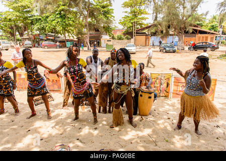 ANGOLA, LUANDA - MARCH 4, 2013:  Unidentified Angolan women make the street performance of the national falk dance for the tourists in Angola, Mar 4,  Stock Photo