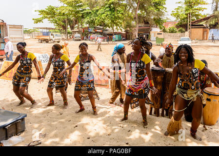 ANGOLA, LUANDA - MARCH 4, 2013:  Unidentified Angolan women make the street performance of the national falk dance for the tourists in Angola, Mar 4,  Stock Photo