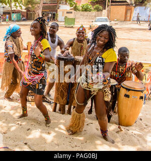 ANGOLA, LUANDA - MARCH 4, 2013:  Unidentified Angolan women make the street performance of the national falk dance for the tourists in Angola, Mar 4,  Stock Photo