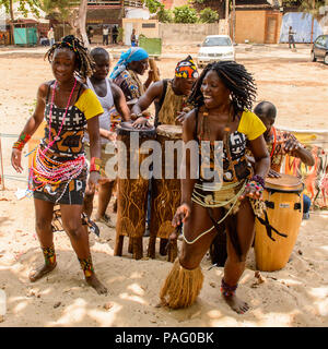 ANGOLA, LUANDA - MARCH 4, 2013:  Unidentified Angolan women make the street performance of the national falk dance for the tourists in Angola, Mar 4,  Stock Photo