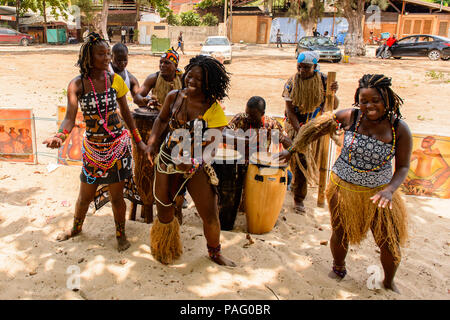 ANGOLA, LUANDA - MARCH 4, 2013:  Unidentified Angolan women make the street performance of the national falk dance for the tourists in Angola, Mar 4,  Stock Photo