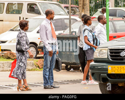 GABON - MARCH 6, 2013: Unidentified Gabonese people waiting for a bus on a bus stop in Gabon, Mar 6, 2013. People of Gabon suffer of poverty due to th Stock Photo