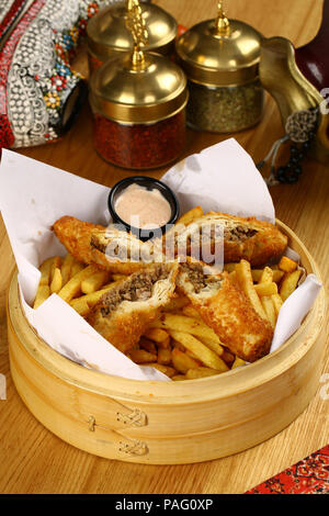 Turkish Pacanga Boregi with french fries Stock Photo