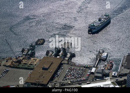 Aerial view of a Washington state ferry boat arriving at the Seattle ferry terminal 801, Alaskan Way, Seattle waterfront, WA, USA. Stock Photo