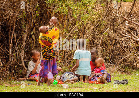 AMBOSELI, KENYA - OCTOBER 10, 2009: Unidentified Massai people in Kenya, Oct 10, 2009. Massai people are a Nilotic ethnic group Stock Photo