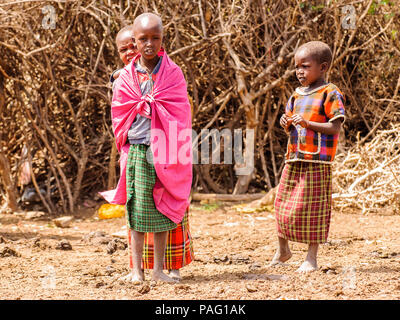 AMBOSELI, KENYA - OCTOBER 10, 2009: Unidentified Massai woman and children wearing tribal typical clothes in Kenya, Oct 10, 2009. Massai people are a  Stock Photo
