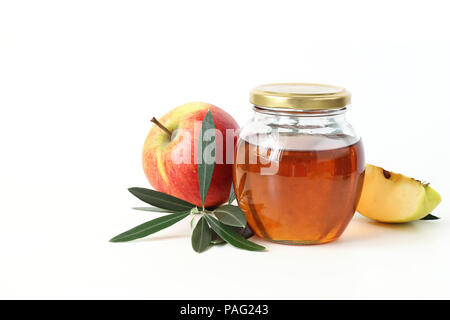 Honey and nuts in jar isolated on white background Stock Photo - Alamy