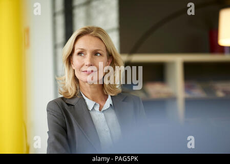Businesswoman in office Stock Photo