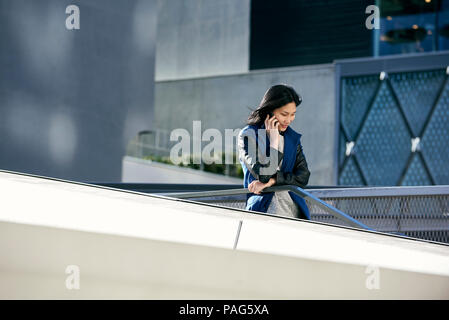 Young woman talking on smart phone Stock Photo