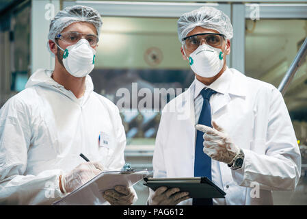 Scientists working in laboratory Stock Photo