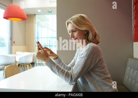 Woman using smart phone Stock Photo
