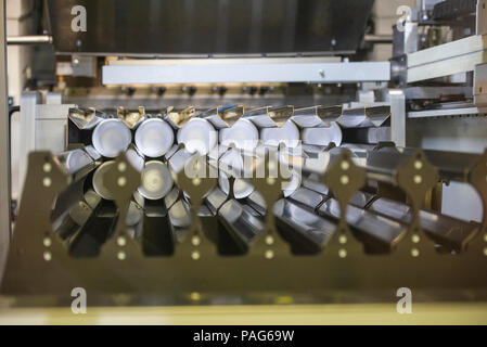 Manufacturing plastic cups in factory Stock Photo