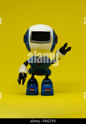 Robot toy waving left hand Stock Photo