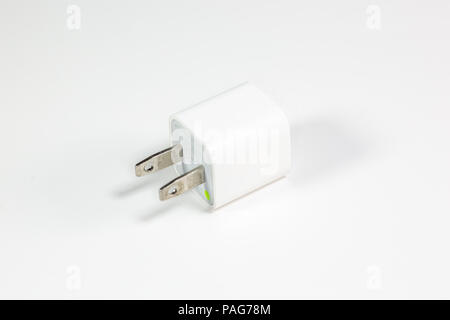 A usb phone and device charger on a white table Stock Photo