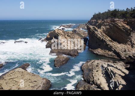 Dramatic rock formations along the coast at Shore Acres State Park near Coos Bay, Oregon, USA. Stock Photo