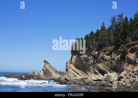 Slanted, dramatic rock formations on the coast at Shore Acres State Park near Coos Bay, Oregon, USA. Stock Photo