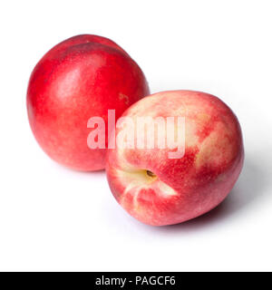 Few tasty nectarines isolated on white background Stock Photo