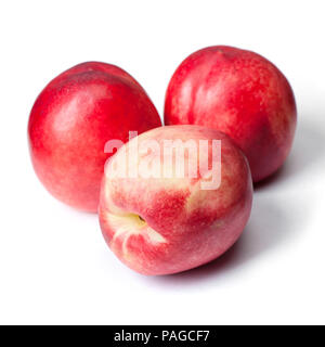 Few tasty nectarines isolated on white background Stock Photo