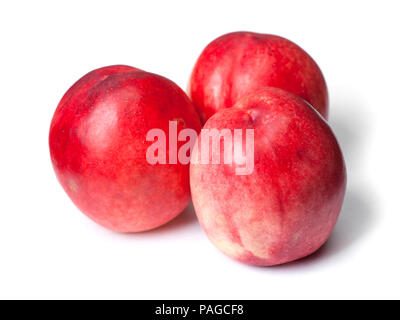 Few tasty nectarines isolated on white background Stock Photo
