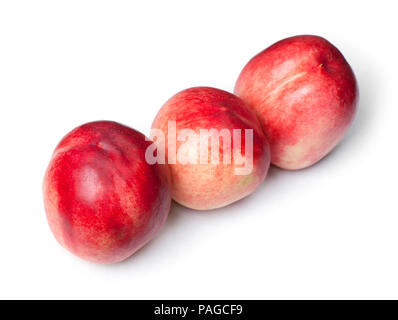 Few tasty nectarines isolated on white background Stock Photo