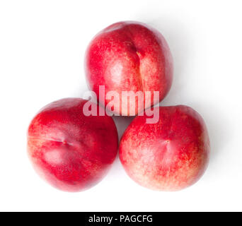 Few tasty nectarines isolated on white background Stock Photo