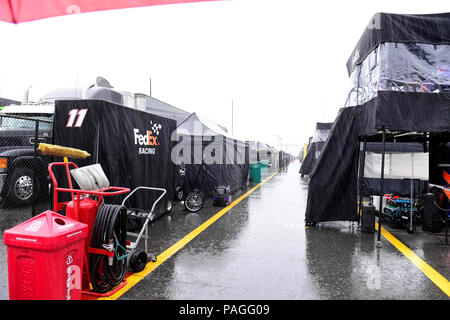 Loudon, New Hampshire, USA. 22nd July, 2018. Pit road remains abandoned in the rain at the NASCAR Monster Energy Foxwoods Resort Casino 301, held at the New Hampshire Motor Speedway in Loudon, New Hampshire. Eric Canha/CSM/Alamy Live News Stock Photo