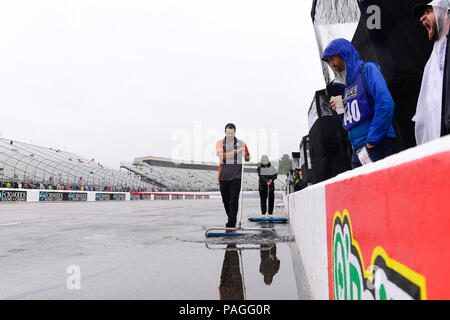 Loudon, New Hampshire, USA. 22nd July, 2018. Pit crews work to remove standing water at the NASCAR Monster Energy Foxwoods Resort Casino 301, held at the New Hampshire Motor Speedway in Loudon, New Hampshire. Eric Canha/CSM/Alamy Live News Stock Photo